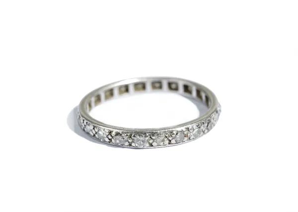 A diamond full eternity ring, mounted with cushion shaped diamonds, ring size L.