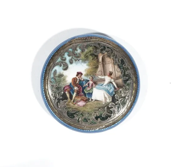 An Austrian silver gilt and enamelled powder compact of circular design, the hinged lid enamelled in colours with figures in a landscape, opening to r