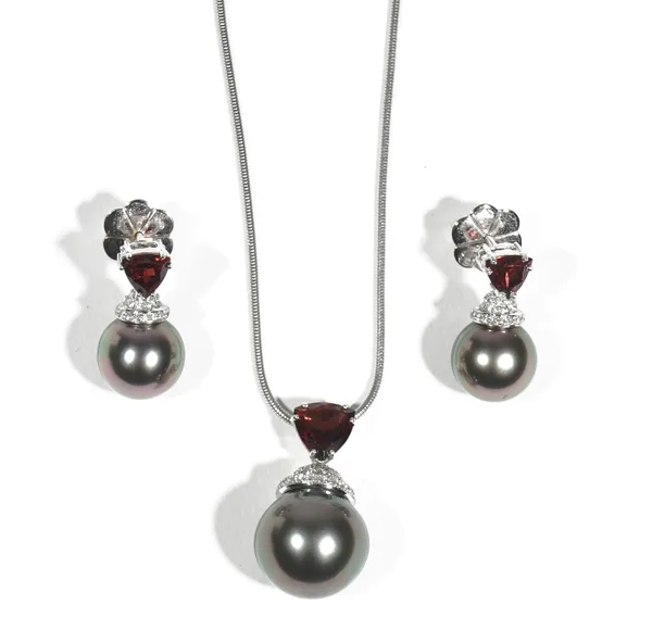 A white gold, garnet, black cultured pearl and diamond-set necklace and earring suite by Autore, the triangular-cut garnet double claw-set suspending