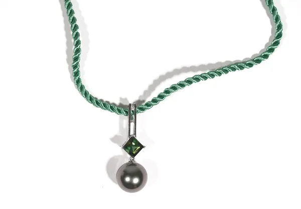 A white gold, green tourmaline, diamond and grey cultured pearl necklace by Autore, the openwork pendant set with a circular-cut diamond above a claw-