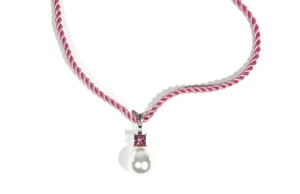 A white gold, pink tourmaline, diamond and cultured pearl pendant necklace by Autore, set with three circular-cut diamonds, above a claw-set square-cu