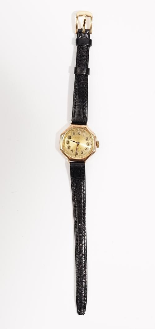 Rolex; a 9ct gold cased wristwatch, the gilt silvered dial with Arabic numbers to a 15 jewel manual wind movement, case numbered 44921, on a replaceme