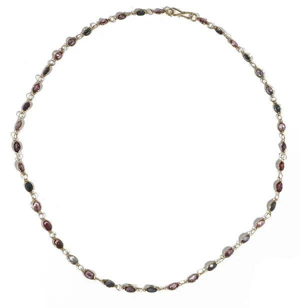 A precious yellow metal and coloured spinel-set necklace, of graduated design, set throughout with oval-cut spinels, 5.6gms.