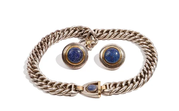 Gucci: a heavy curb link silver necklace, centred by a lapis lazuli cabochon and heightened with gilding, 43cm long and a pair of matching buckler sty