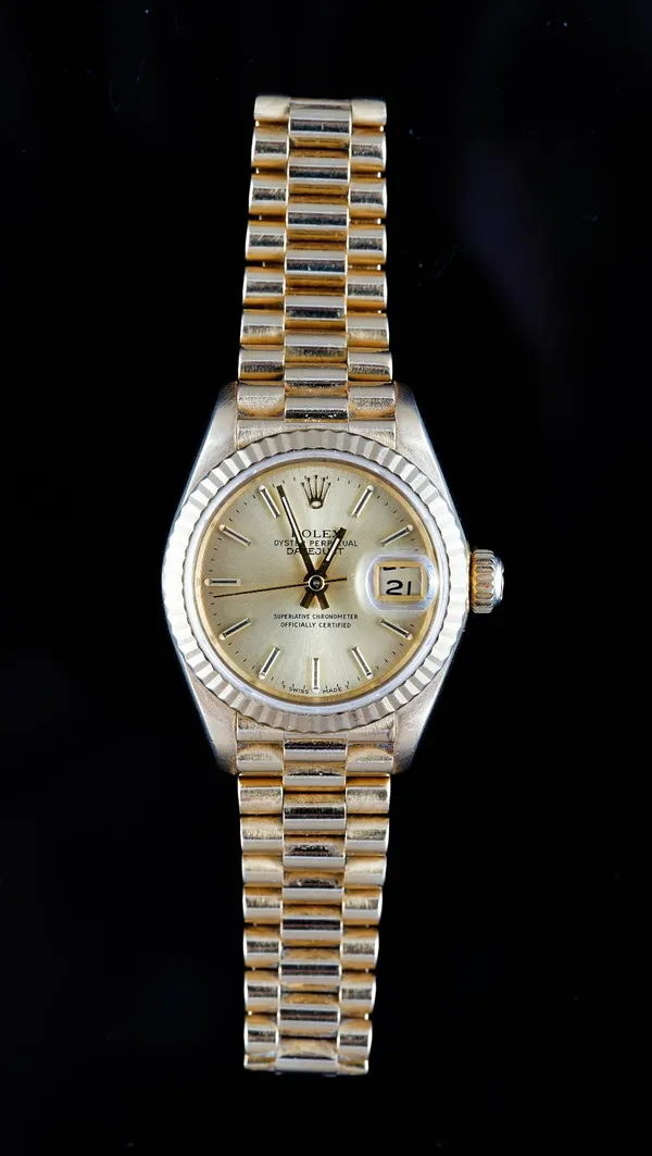 A Rolex Oyster Perpetual Datejust 18ct gold lady's bracelet wristwatch, the signed gilt dial with gilt baton numerals, gilt hands, centre seconds and