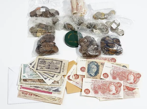 A quantity of British and foreign bank notes and coins, including; a Bank of England five pound note, L.K.O'BRIEN, a ten shilling note, B.S CATTERNS,