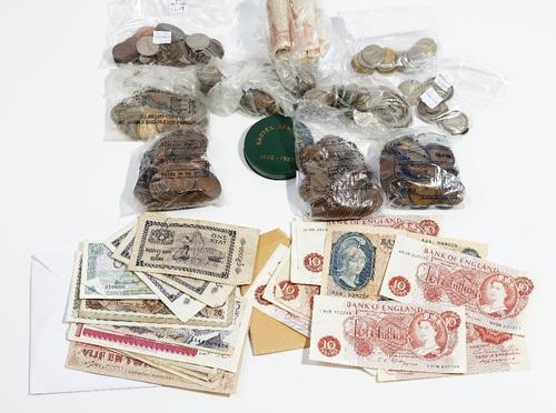 A quantity of British and foreign bank notes and coins, including; a Bank of England five pound note, L.K.O'BRIEN, a ten shilling note, B.S CATTERNS,