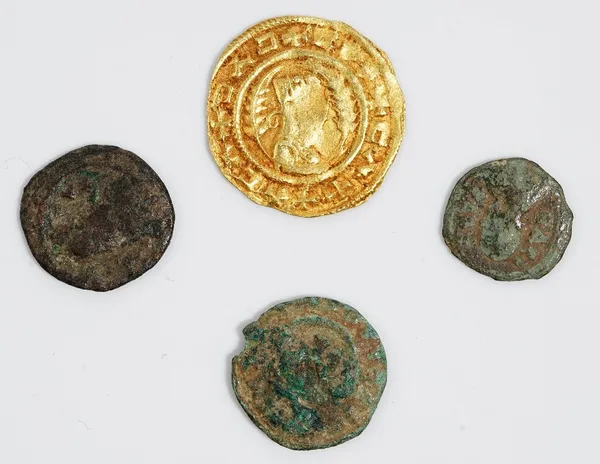 A group of four ancient coins, comprising: an Ethiopian Aksum? gold coin, diameter 17.3mm, weight 1.6 gms and three ancient bronze small coins, (4).