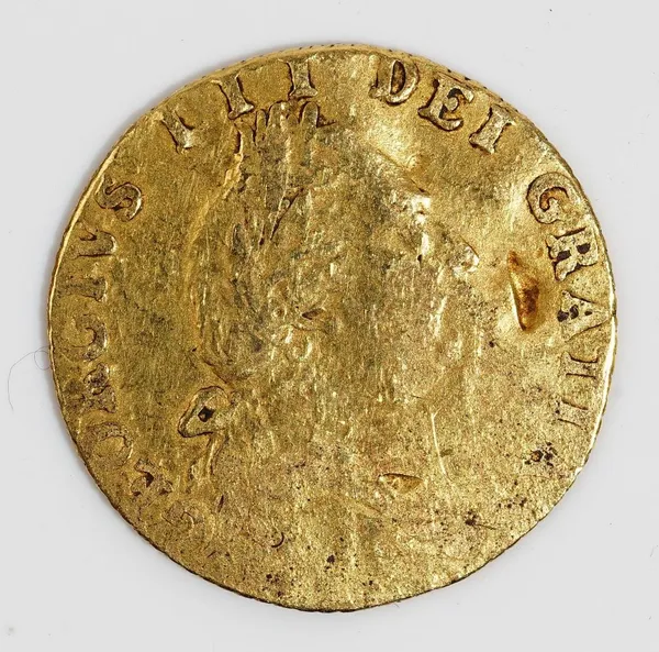 A George III half spade guinea 1788. (very worn)