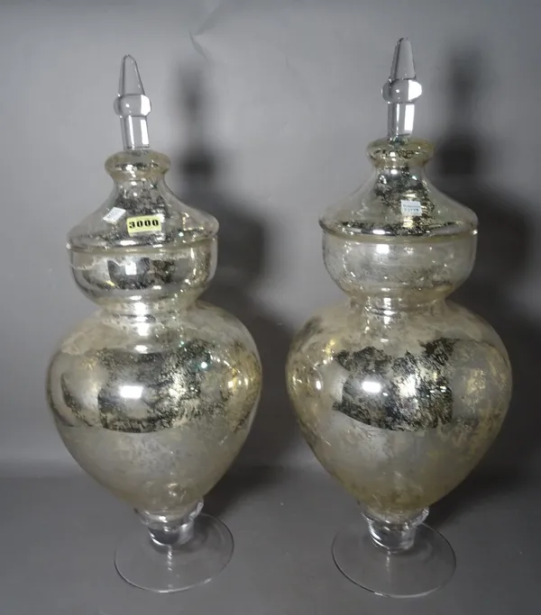 A pair of modern decorative silvered glass lidded vases, 61cm tall (2).