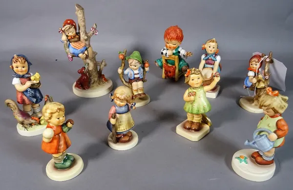 A group of ten Hummel figurines.