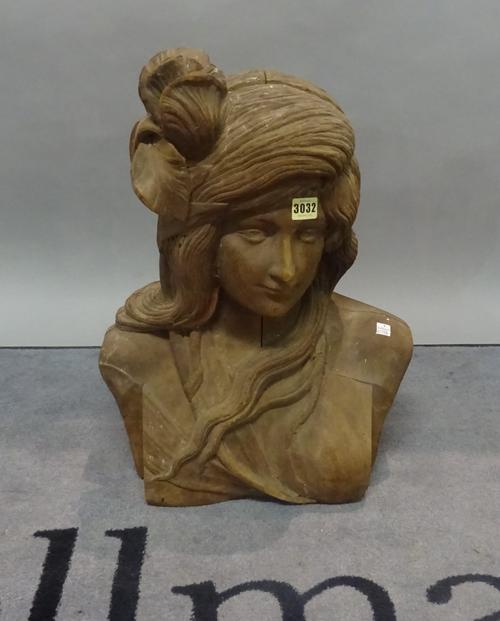 An early 20th century hardwood female bust, 41cm wide x 55cm high.