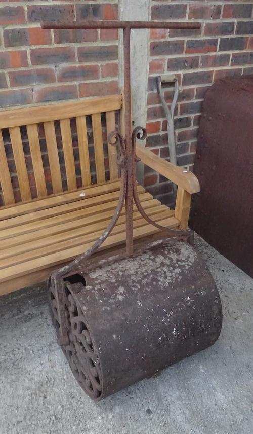 An early 20th century cast and wrought iron garden roller, 60cm wide.