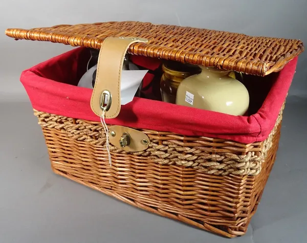 'Agaluxe', a modern stainless steel kettle, a brass dinner gong, 31cm high, a stoneware vase, 20cm high, and a wicker basket, 46cm wide x 22cm high (5