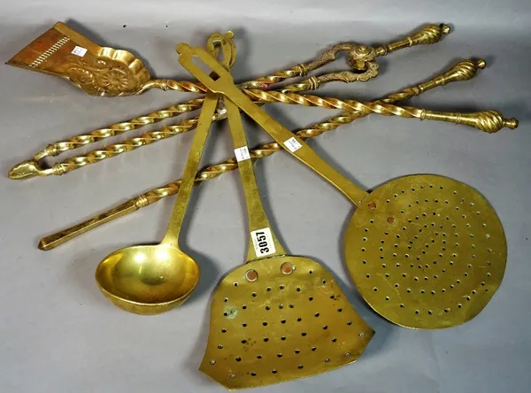 A quantity of 19th century brass fire tools, (qty).