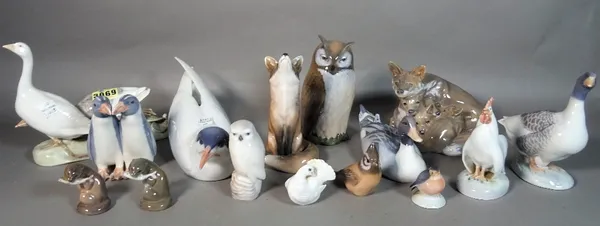 A group of Royal Copenhagen porcelain figurines, mainly models of animals.