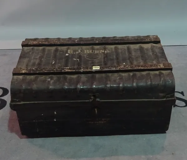 An early 20th century black painted metal travelling trunk, 74cm wide x 36cm high.