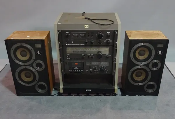 AKAI AM-2450,  a modern hi-fi system, 56cm wide x 72cm high, a pair of WHARFEDALE E THIRTY speakers, 33cm wide x 58cm high.