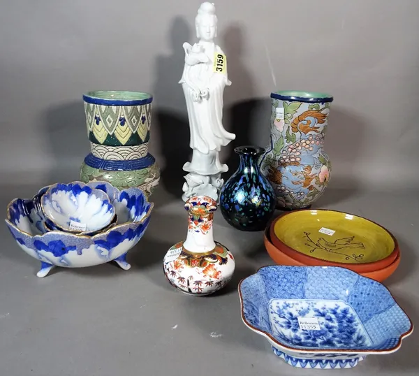 Ceramics; an Asian 'blanc de chine' figure of Guan Yin, Asian style pottery vases, Isle of Wight glass vase and sundry.