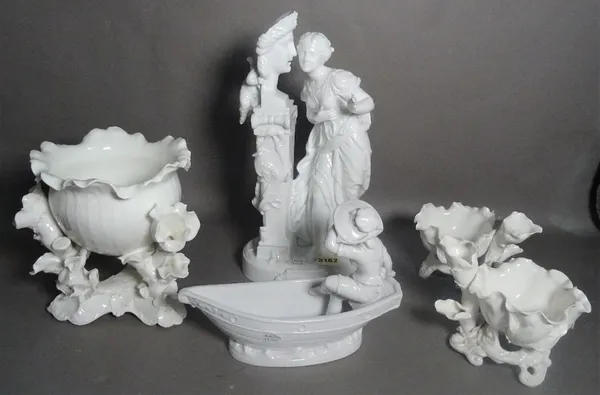 A group of white glaze porcelain, including large porcelain figure group of a lady, floral decorated bowls and sundry.