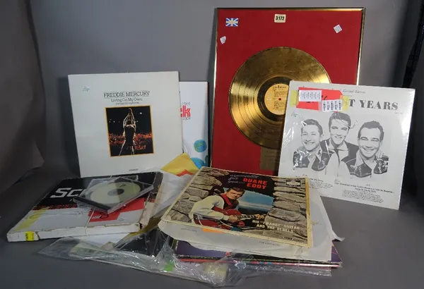 Entertainment interest, including; a quantity of records and ephemera including an Elvis gold disk, letters and sundry, (qty).