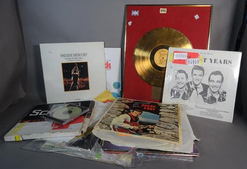 Entertainment interest, including; a quantity of records and ephemera including an Elvis gold disk, letters and sundry, (qty).