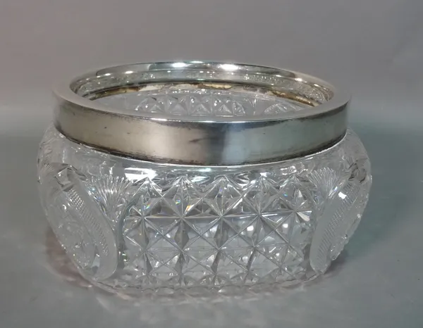 Silver and silver mounted wares, comprising; a faceted glass salad bowl, having a silver rim, Birmingham 1938, two napkin rings, Birmingham 1948 and