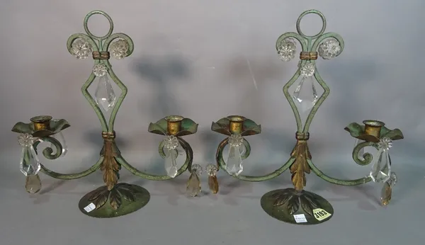 A pair of modern green painted metal two branch candelabra, with glass drop decoration, 32cm wide x 35cm high.