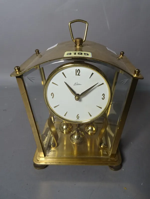 A modern stylised anniversary type mantel clock by 'KUS-MIV', Germany, 24cm high.