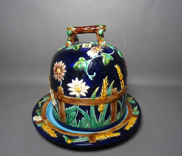 A majolica style blue ground cheese dome and stand, impressed 1189, 29cm. high, (2).