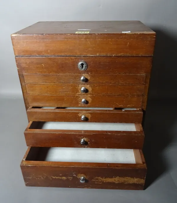 An early 20th century small mahogany collectors chest with lift top over six graduated drawers, 33cm wide x 37cm high.