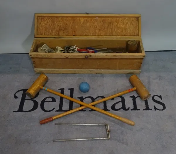 A modern cased croquet set, 99cm wide x 30cm high.