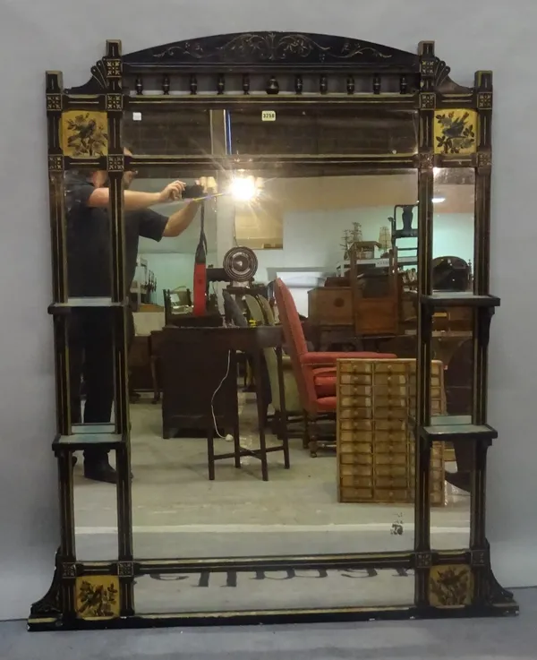 A late Victorian ebonised Aesthetic Movement overmantel wall mirror, 109cm wide x 150cm high.