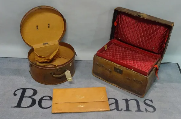 JOHN POUND & Co: a leather travelling case 55cm wide x 33cm high, a similar hat box 46cm wide x 26cm high and a travelling shirt case (3).