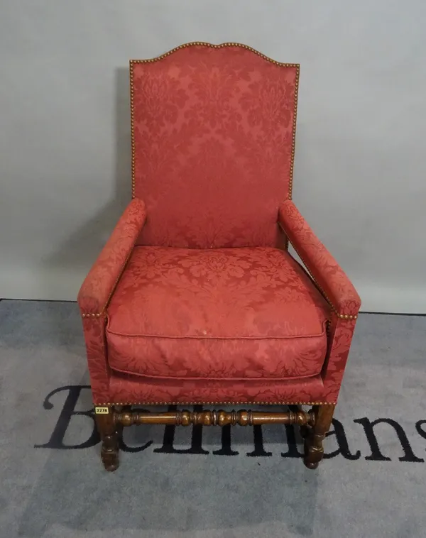 A 19th century mahogany framed highback open armchair on ring turned supports, 62cm wide x 105cm high.