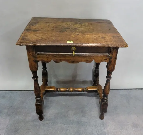 An 18th century oak single drawer side table on turned supports, united by 'H' frame stretcher, 57cm wide x 63cm high.