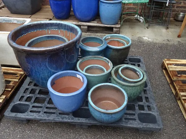 A group of eleven garden pots, various sizes, the largest 58cm diameter x 46cm high.