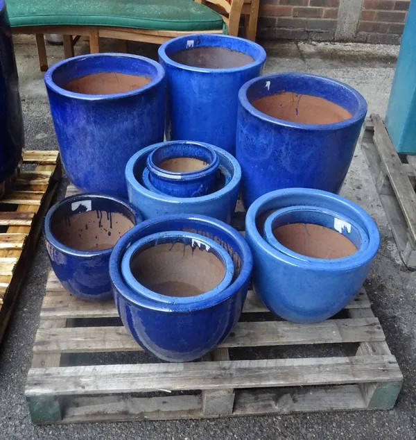 A group of eleven modern garden pots, the largest 10cm wide x 48cm high.