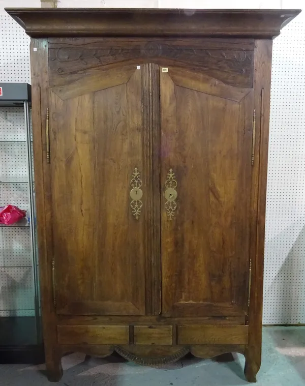 A 19th century and later French oak two door armoire with arched doors on cabriole supports, 150cm wide x 226cm high.