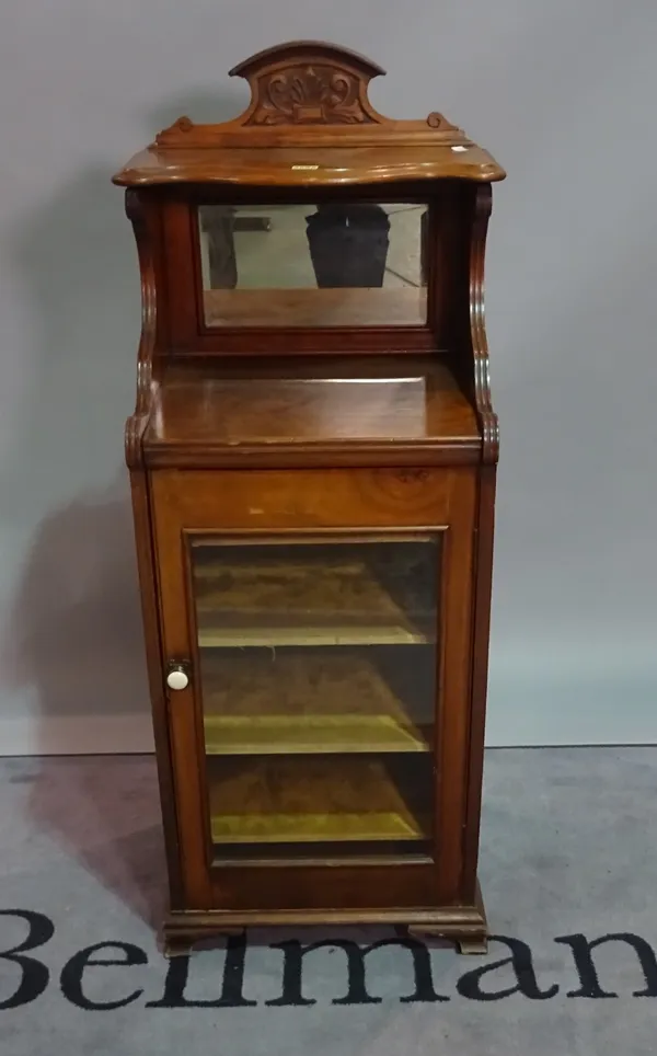 A 19th century glass fronted music cabinet with mirrored back on bracket feet, 46cm wide x 125cm high.