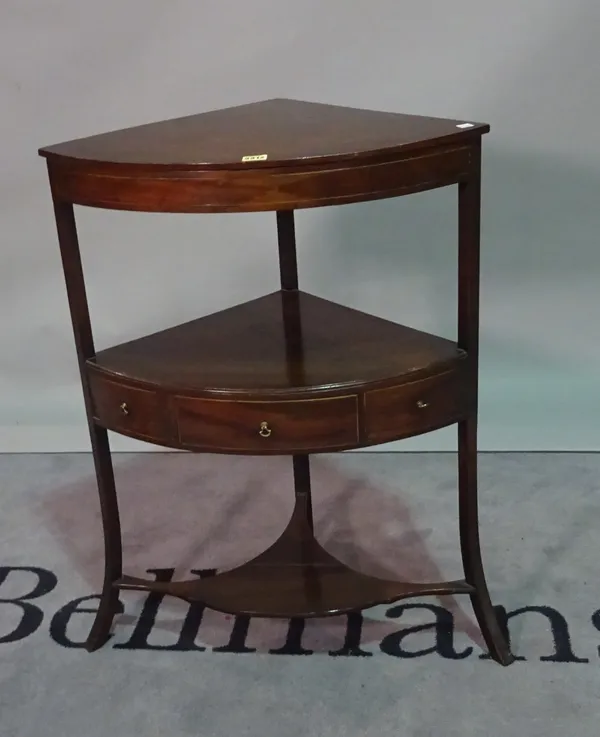 A Regency mahogany corner washstand, on outswept supports, 63cm wide x 86cm high.