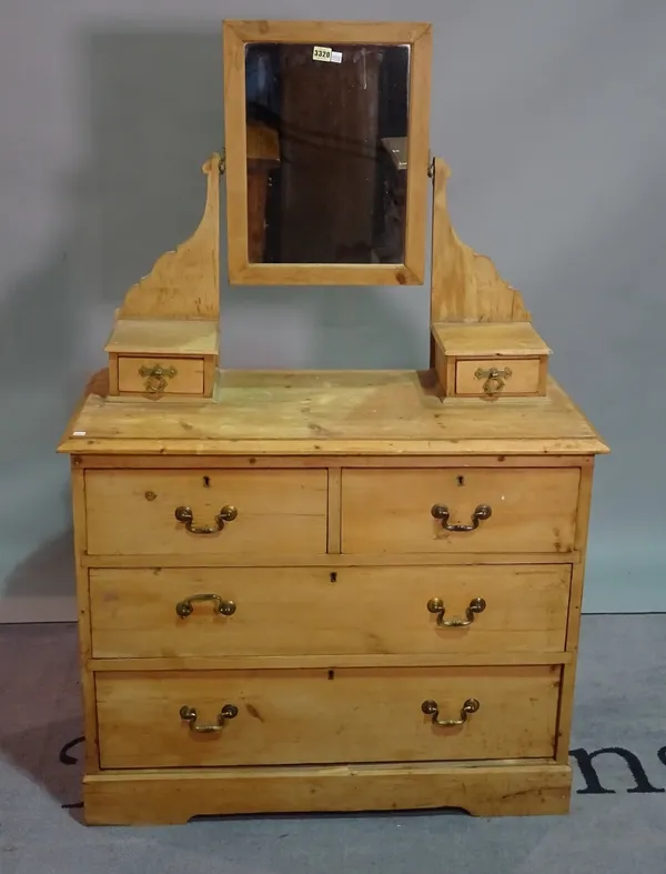 A pine dressing chest, with swing mirror over two short and two long drawers, 91cm wide x 137cm high.