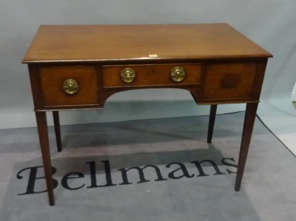 A George III mahogany kneehole writing desk, the three frieze drawers on tapering square supports, 100cm wide x 76cm high.