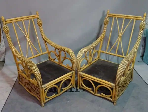 A pair of 20th century bamboo low armchairs with padded arms, 68cm wide x 105cm high, (2).