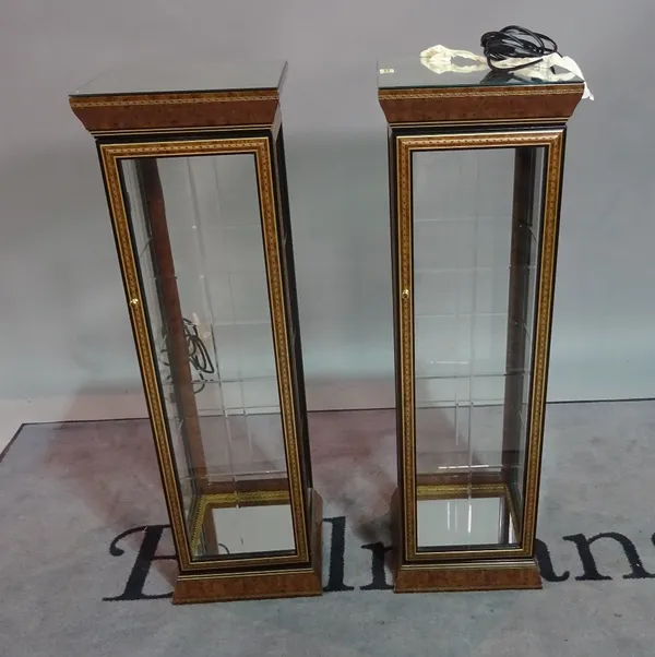 A pair of modern walnut lacquer display cabinets, the mirrored tops on square plinth base, 30cm wide x 98cm high, (2).