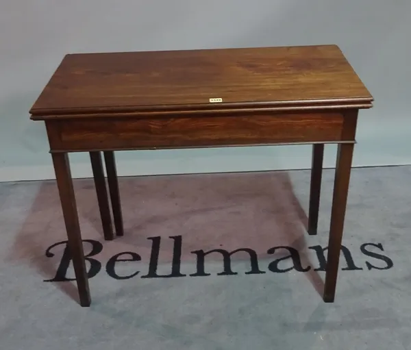 A George III style mahogany foldout tea table, on square supports, 90cm wide x 71cm high.