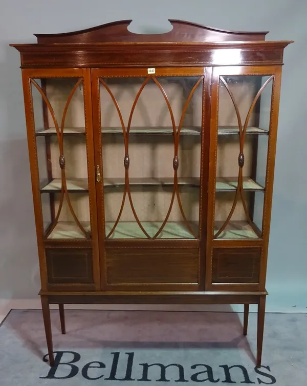 An Edwardian inlaid mahogany display cabinet, on tapering square supports, 122cm wide x 180cm high.