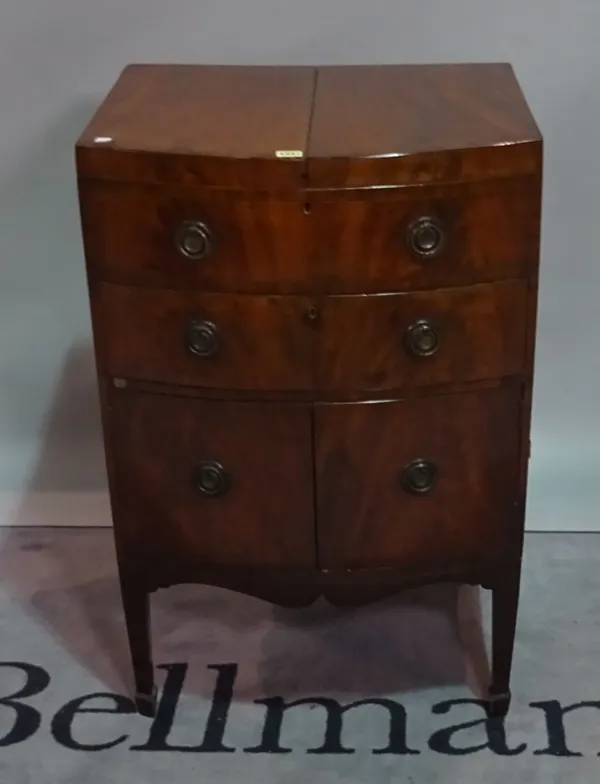 A George III mahogany bowfronted gentleman's washstand, on tapering square supports, 60cm wide x 90cm high.