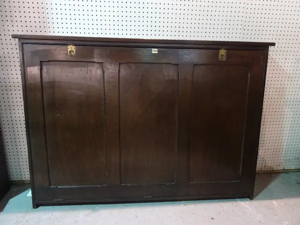 An early 20th century slope fronted folio cabinet, 148cm wide x 102cm high.