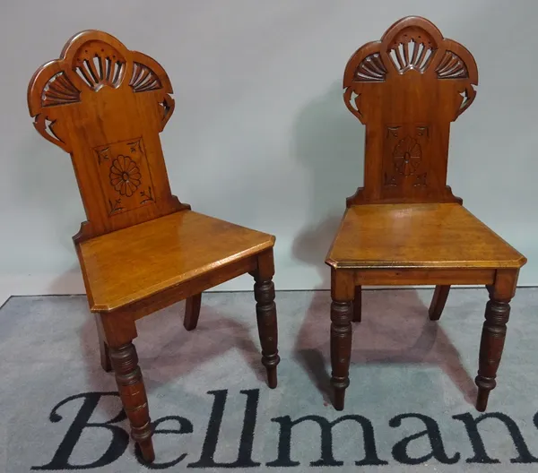 A pair of late Victorian walnut framed hall chairs, 43cm wide x 88cm high.